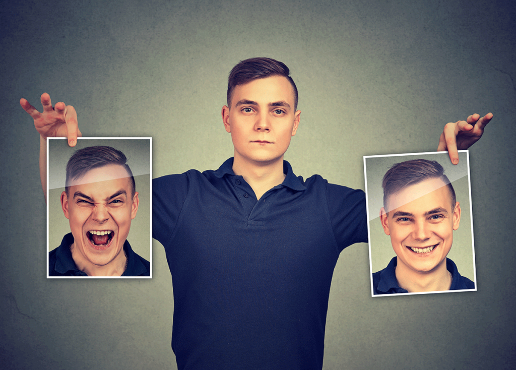 man holding up two pictures of himself wonders can you develop bipolar disorder