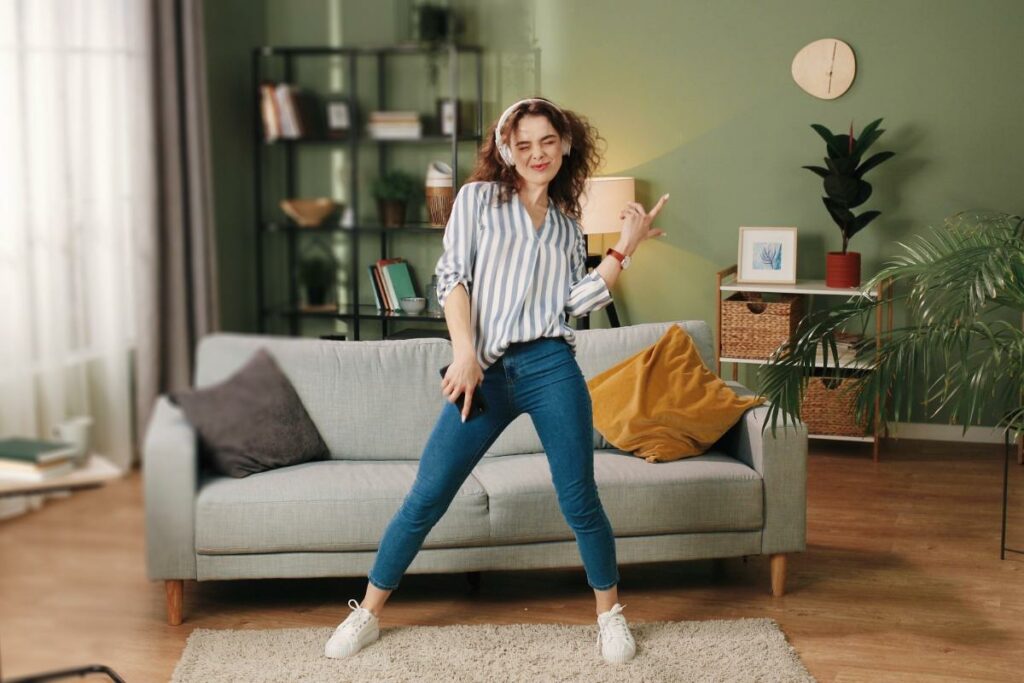 a person dances in a living room to show types of dance therapy