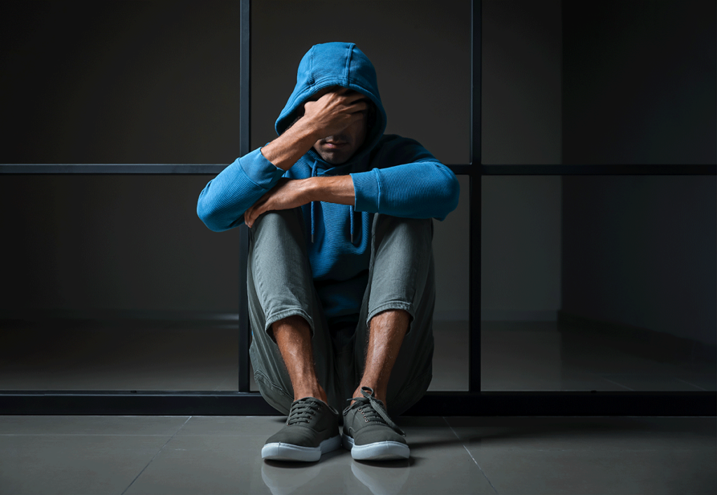 person sitting by the wall considers cocaine ingredients