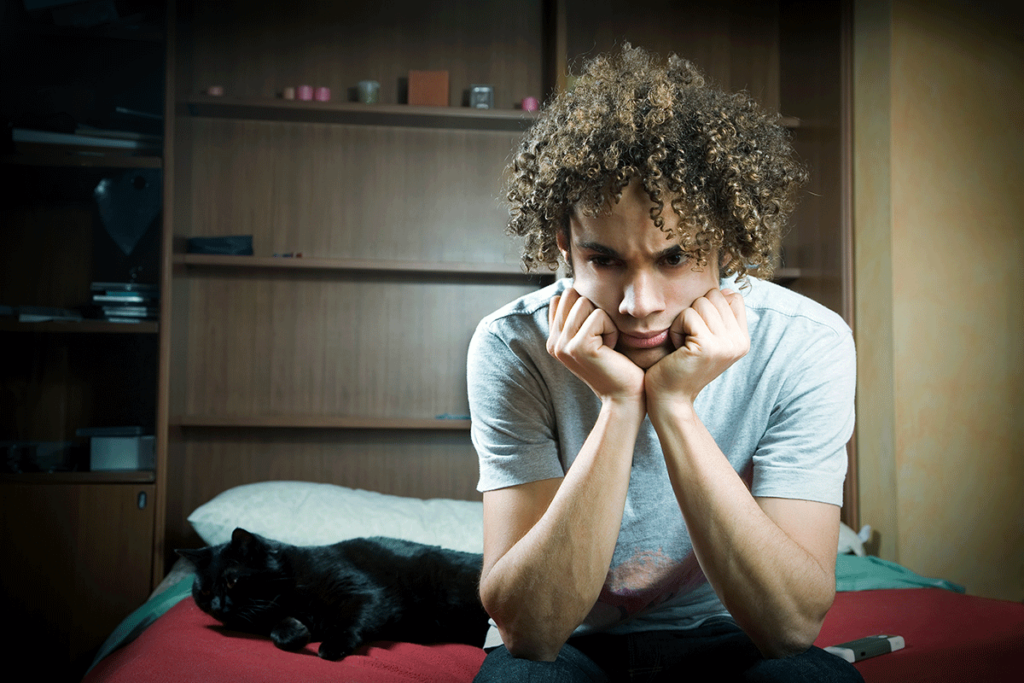 a teen rests their head in their hands and wonders about antidepressants for teens