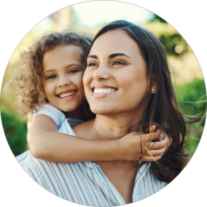 woman and child outdoors at honey lake clinic smiling
