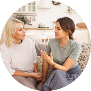 two women talking on couch at honey lake clinic