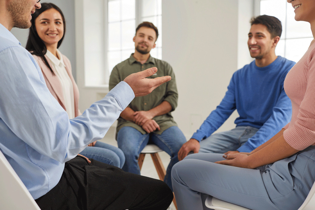 a group of people sit in a circle and talk about what is a php