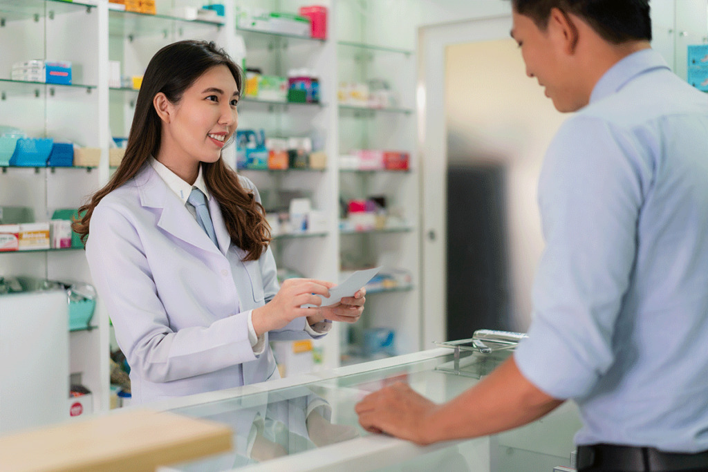a pharmacist talks to a patient about the side effects of adderall