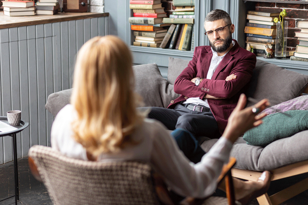man talks with therapist about the primary benefits of christian counseling