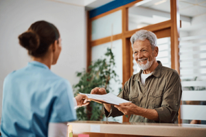 man talks with client about optum mental health coverage
