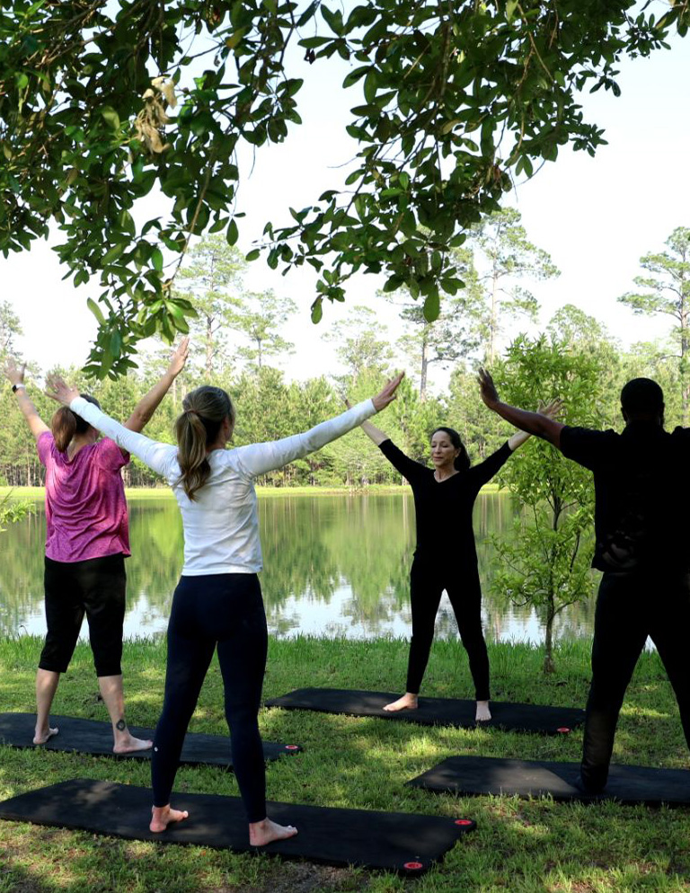 Residents practicing mindfulness with Dawn Rettig, Wellness Director, at Honey Lake Clinic